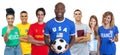 Football fan from USA with soccer ball supporters from Spain Brazil Mexico Qatar Argentina and France Royalty Free Stock Photo