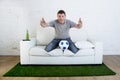 Football fan watching tv soccer match suffering stress nervous c Royalty Free Stock Photo