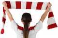 Football fan waving red and white scarf Royalty Free Stock Photo