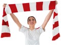 Football fan waving red and white scarf Royalty Free Stock Photo