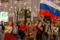 Football fans of different countries celebrate the victory of the Russian team over Spain at Nicholas Street in Moscow