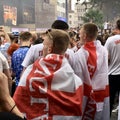 Football fans of England with the national flag glorify their team in the World Cup before the match