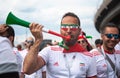 Football fan of Iran at 2018 world cup in Russia with pipe and color glasses