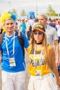 Football fans from Sweden, married couple, with painted faces in national colors before the match England Sweden at the World Cup