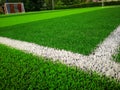 Football field, astro turf surface. Close up of throw in, kick off and corner area. Lushed green football pitch Royalty Free Stock Photo