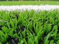 Football field, astro turf surface. Close up of throw in, kick off and corner area. Lushed green football pitch Royalty Free Stock Photo