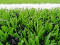 Football field, astro turf surface. Close up of throw in, kick off and corner area. Lushed green football pitch Royalty Free Stock Photo