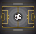 Football field with circular grass texture and soccer ball, black and yellow color combination Royalty Free Stock Photo