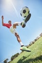 Football, fitness and soccer player training with a juggling exercise on soccer field, grass or football stadium. Sports Royalty Free Stock Photo