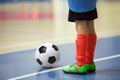 Football futsal training for children. Indoor soccer young player Royalty Free Stock Photo