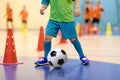 Football futsal training for children. Soccer training dribbling cone drill Royalty Free Stock Photo