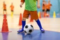 Football futsal training for children. Soccer training dribbling cone drill. Indoor soccer young player
