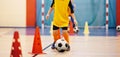 Football futsal training for children. Soccer training dribbling cone drill Royalty Free Stock Photo