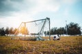 Football gate or soccer goal in neglected on field with football Royalty Free Stock Photo