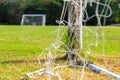 Football goal and goalpost with fresh green grass at stadium Royalty Free Stock Photo