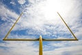 Football goal posts - whispy white clouds blue sky