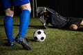 Football goalkeeper diving to stop a goal