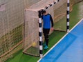 Football goalkeeper on goal, field, Futsal ball field in the gym indoor, Soccer sport field Royalty Free Stock Photo