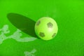 Football green ball on the green playground Royalty Free Stock Photo