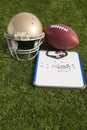 Football Helmet Ball Clipboard and Whistle Portrait