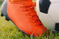 Football Kick Moment. Close-up on Soccer Cleat and Soccer Ball