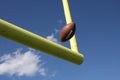 Football kicked through the uprights Royalty Free Stock Photo