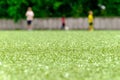 Football lawn, three player in background