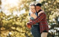 Football, love and interracial couple with a hug in nature for sports, playful and bonding. Affection, happy and black Royalty Free Stock Photo