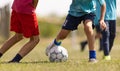 Football Match for Children. Boys Running and Kicking Football on the Sports Field. Royalty Free Stock Photo