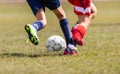 Football Match for Children. Boys Running and Kicking Football on the Sports Field Royalty Free Stock Photo