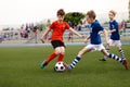 Football match between youth soccer teams. School boys playing soccer game Royalty Free Stock Photo