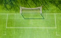 Football net on the background of a green football field. Aerial view of football gate