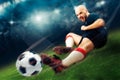 Football player in action makes a tackle in the game Royalty Free Stock Photo