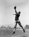 Football player catching ball Royalty Free Stock Photo