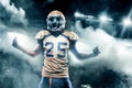 Football player celebrates after scoring a touchdown. Royalty Free Stock Photo