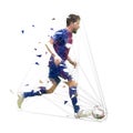 Football player in dark blue jersey running with ball, abstract low poly vector drawing. Soccer player kicking ball. Isolated Royalty Free Stock Photo