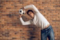 Football player doing a lateral ball throw