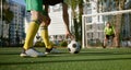 Football player going to hit soccer ball to score goal Royalty Free Stock Photo