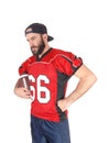Football player holding his ball and relaxing Royalty Free Stock Photo