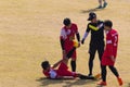 Vientiane Capital, Laos - November 25, 2017: Football player injured on the pitch during the match of Hmong New Year celebration i