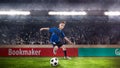 Football player kid dribbling on soccer stadium