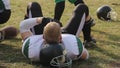 Football player lying on helmet at stadium, break during training, gridiron