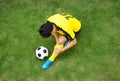 Football player lying injured on the pitch. Royalty Free Stock Photo