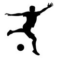 Football player silhouette jumps up, preparing to kick the ball with his foot