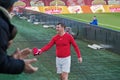 Football player throws a t-shirt into stands