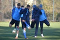 football players are doing stretching legs together october team dnepr dnepropetrovsk ÃÂity held an open training session at their Royalty Free Stock Photo