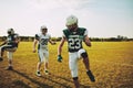 Football players doing warm ups together on a sports field Royalty Free Stock Photo