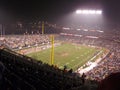 Football players line up for play in the rain