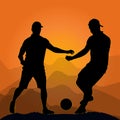 Soccer players at sunset. Footballer silhouettes with soccer ball on hill background. Royalty Free Stock Photo