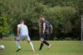 Football players playing soccer in the ground Royalty Free Stock Photo